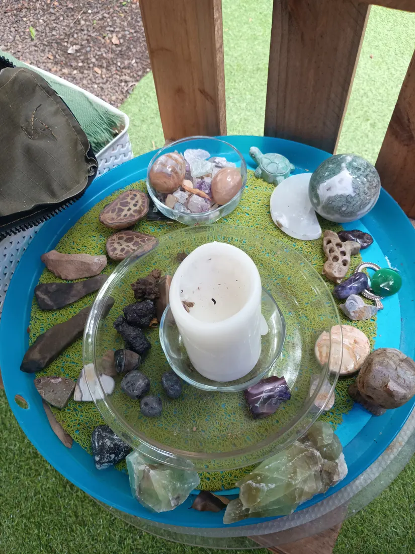 Melinda's crystal collection — moss agate sphere, green fluorite and tumbled stones